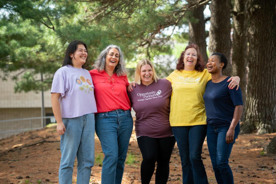 Staff members laughing together