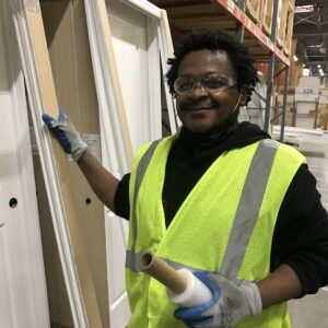 Man in yellow vest smiling