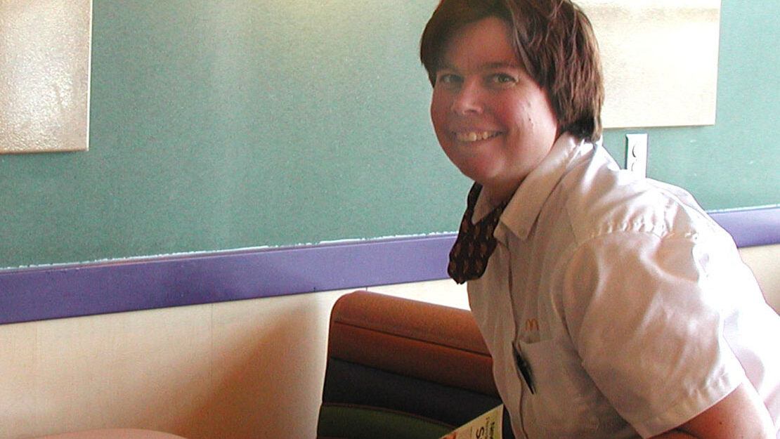 Woman smiling working in McDonalds