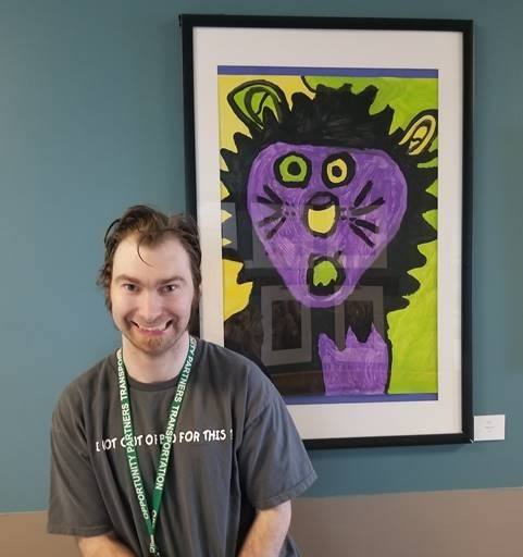 JT Buell pictured with his artwork