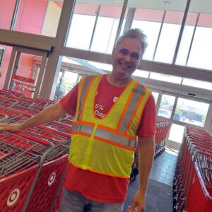 Man in a neon vest working with shopping carts in target