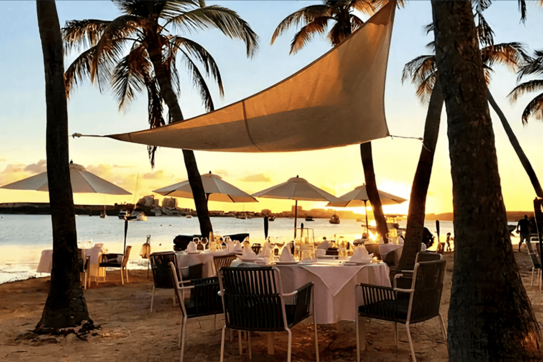 Dining tables set up on the beach